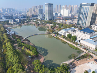 Wuhan Houxiang Park Aerial View with Lake and Urban Skyline © TranPhuoc