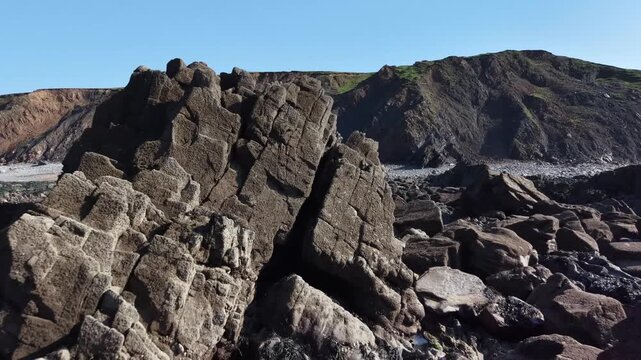 Flying close to rocks with drone on a Cornish beach