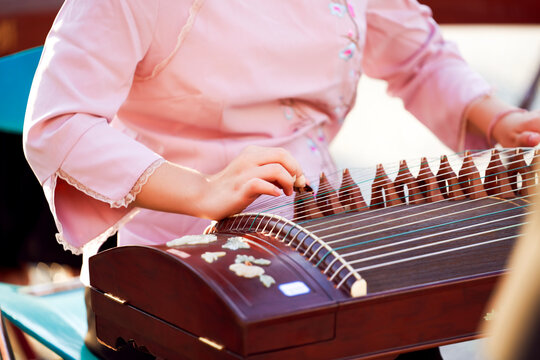 Playing the guzheng