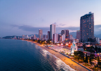 Naklejka premium Nha Trang Vietnam coastal skyline at with vibrant colors and urban beach scape, Aerial view