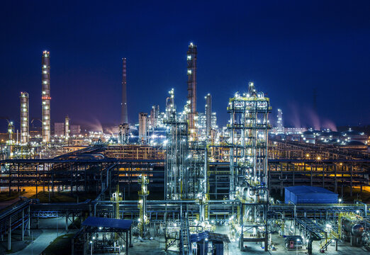 Petrochemical Refinery Plant at Night with Industrial Towers