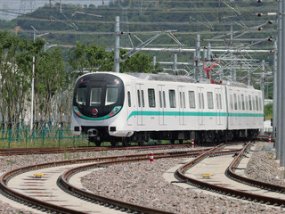 Obraz premium Wuhan Metro Train on Suburban Railway Tracks