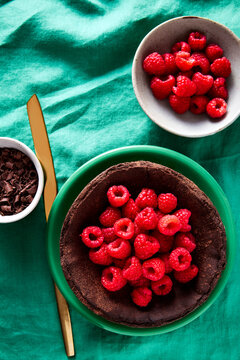Chocolate Basque Cheesecake with Raspberries and Chocolate Curls