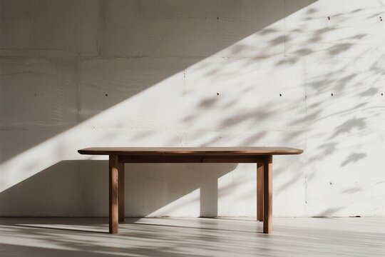 Wooden table against concrete wall