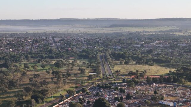 Drone approaching small city from rural countryside