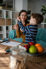 Fototapeta premium Mother and son bonding exploring creativity at home