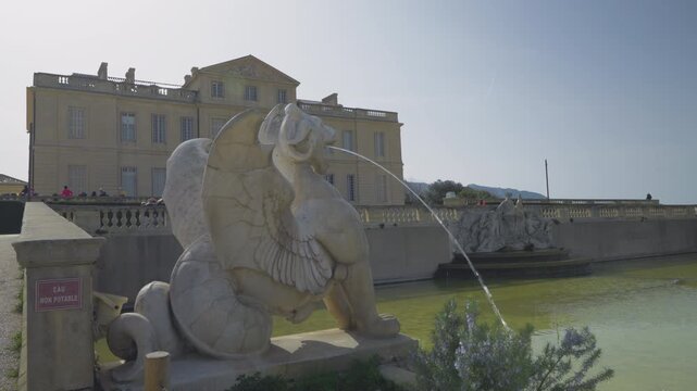 view of the Borely Castle in Marseille with on foreground a lion statue. Borely Park is a Famous place in Marseille- Travel in France