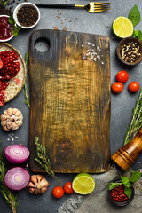 Kitchen background for menu or banner design. Kitchen cutting board, spices, vegetables and kitchen...