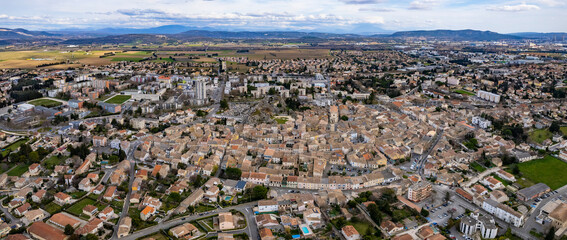  Aerial panorama view beside the old town around the city Pierrelatte in France on a cloudy spring day.  © Tony