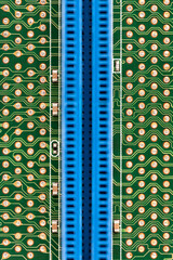 Macro image of a PCB with a vertical blue connector and gold-plated solder pads. Clean, minimal, and technical composition suitable for electronics, hardware engineering, and digital infrastructure th © Adriano