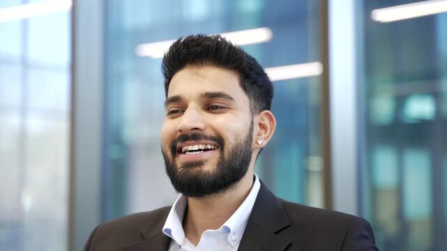Smiling businessman in formal suit relaxing with eyes closed at workplace in business office. Calm happy worker resting in break at work breathing deeply, feels peace of mind relieve stress. Close up.