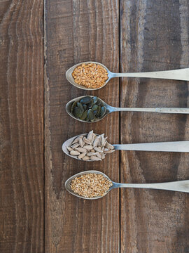 Healthy seeds on spoons for nutritional eating