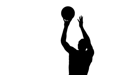 Man playing basketball in silhouette. © Pidi