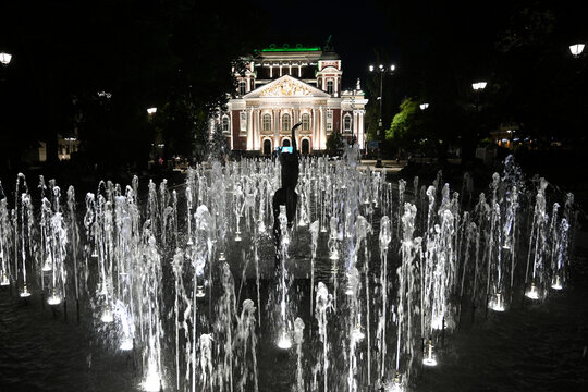 Sofia, Bulgaria - June 14, 2025: The fountain in front Ivan Vazov National Theatre in Sofia at night.