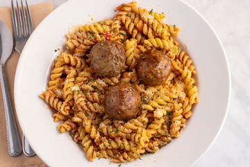 rotoni with herbs and cheese  top with meat balls