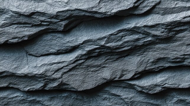 Close up of textured dark gray slate stone surface background