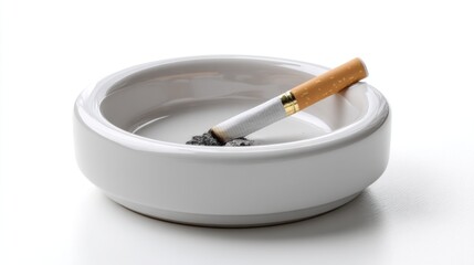 Cigarette and ash in simple ceramic ashtray isolated on white, suitable for anti-smoking campaigns and product photography 