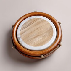 Obraz premium Top view of handcrafted hand drum with wooden frame, isolated on light background, great for artisanal music or cultural celebration themes 