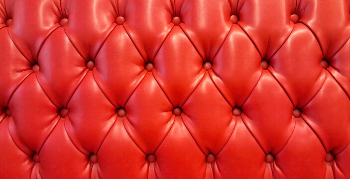 Close-up of red button tufted leather upholstery