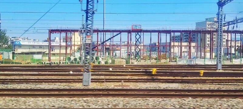 Passing View of Korail Mugunghwa-ho Train and Railway Construction Site in South Korea.