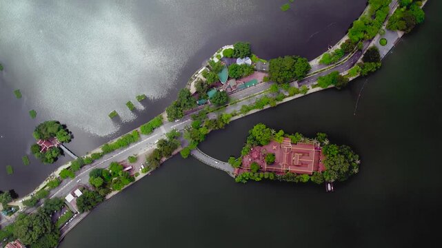 Overhead drone view of tran quoc pagoda and thanh nien road splitting west lake in hanoi, vietnam