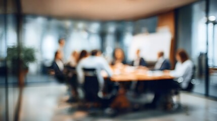 Obraz premium Business professionals are collaborating around a conference table in an abstract, blurred office setting, representing teamwork, discussion, and strategic planning in a corporate environment