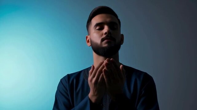 Spiritual Reflection and Prayer: Young Muslim Man Praying with Hands Raised