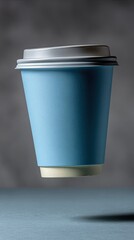 Steaming takeaway coffee cup in warm evening cafe light with bokeh background