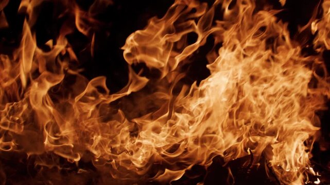 Fire flames with high contrast. Fire burning realistic combustion. Fire blazing visual power. Fire abstract overlay texture.