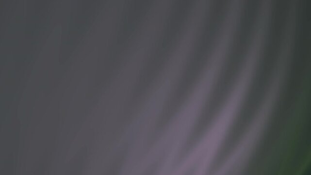 Blurred abstract pattern with dark gray and purple hues. Suitable for backgrounds, digital designs, prints, or artistic projects.