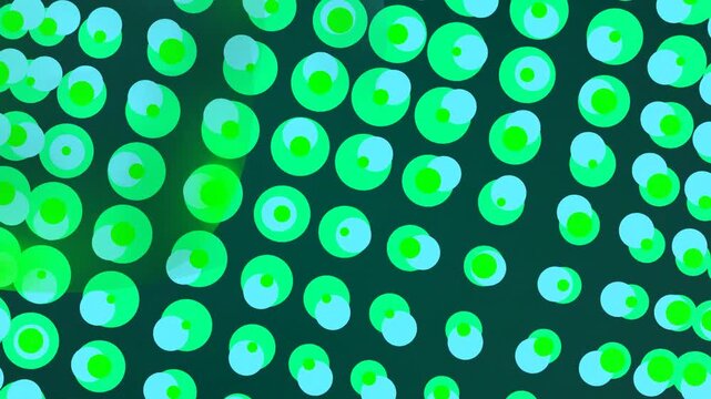 Glowing Green Cells Under Microscope View.