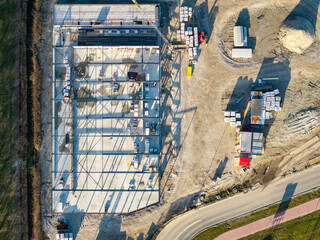 Fototapeta premium Top down aerial of industrial building construction site