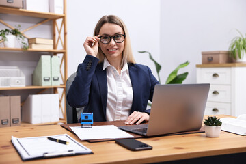 Fototapeta premium Portrait of notary at wooden desk in office