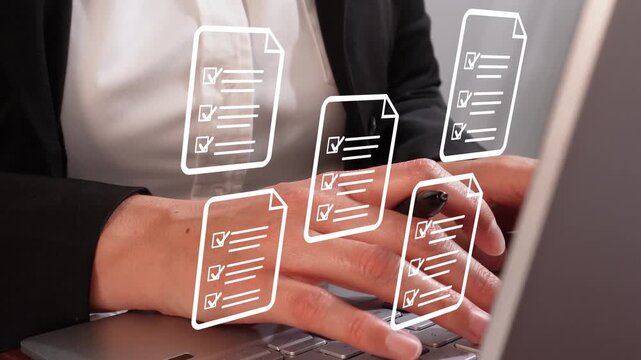 Concept of approving. Close-up of a woman's hands typing on a computer with several document icons with check marks in lists