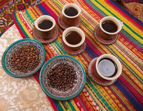 Ethiopian coffee ceremony with coffee beans and cups