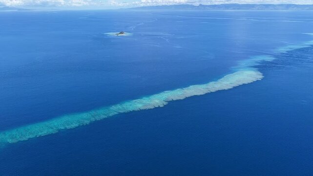 A shallow coral reef is found in the midst of the Bligh Channel in Fiji. Fiji's coral reefs support high marine biodiversity and are a popular destination for scuba divers and snorkelers.