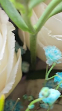 Colorful bouquet of roses in vertical composition for celebration background. Floral arrangement with multicolored blossoms, festive mood with birthday, love, anniversary, wedding, greeting themes.