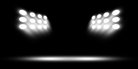 Professional stadium floodlights illuminating dark arena stage with white light beams for sport event background © riazul