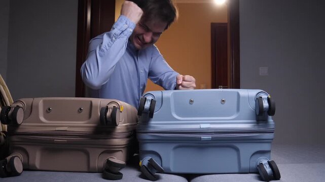 Man feeling stress and frustration while packing an overfilled suitcase and struggling to close it, preparing for a trip or vacation, dealing with excessive luggage