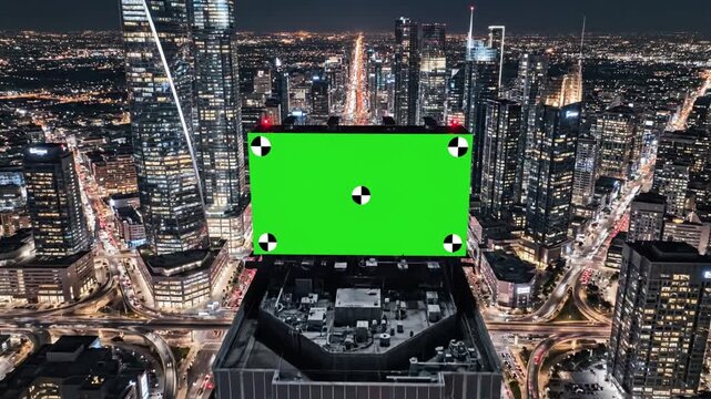 Dynamic Urban Metropolis with aerial top view of skyscrapers and green screen build board tracking point bird modern city at night streets distortion, overlay, glitch, static noise, scan lines on