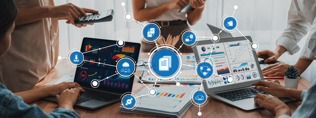 Panorama shot analyst team utilizing BI Fintech to analyze financial report with laptop. Businesspeople analyzing BI power dashboard displayed on laptop screen for business insight. Scrutinize Amity