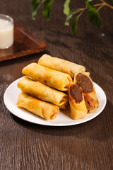 Golden Crispy Spring Rolls Stuffed with Bean Paste - Delicious Deep Fried Gourmet Vegetarian Food