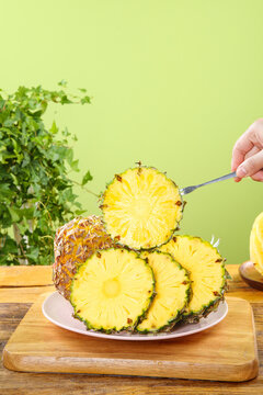 Fresh Sliced Pineapple from Guangdong China - Sweet Tropical Fruit on Wooden Board
