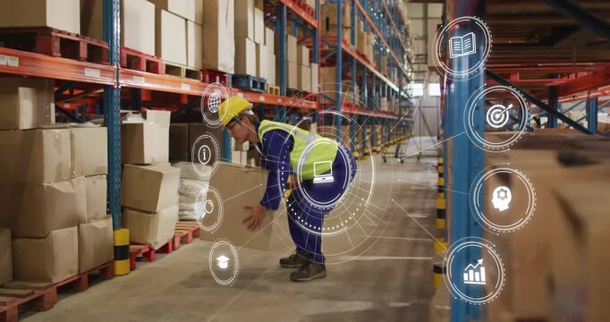 Male warehouse worker bending gripping lifting placing box after AR icons on hands prompt inventory