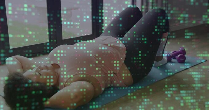 Woman doing crunches on blue mat starting fitness set while green square overlay tracking reps