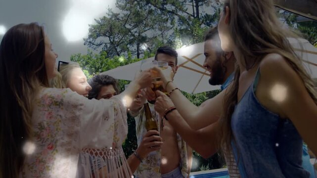 Six friends clinking green beer at pool, sparking floating lights celebrating summer marketing