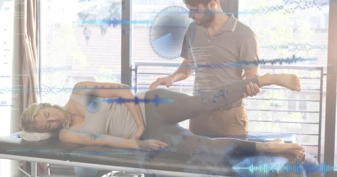 Clinician performing Ober test on table with sidelying patient lifting leg assessing IT band length