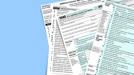 Overhead view of US individual income tax form 1040 and Schedule 1
