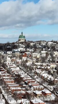 Saint Josephs Oratory dome above snowy Westmount and Montreal neighborhood on Mount Royal hill in winter, Quebec, Canada. g.
