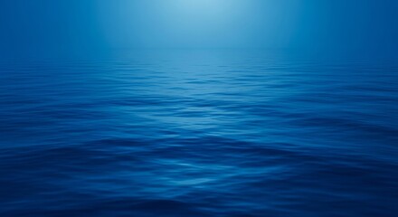 Fototapeta premium A tranquil, deep blue expanse of water reflects soft light, evoking the profound stillness before oceanic forces awaken and emerge, presence, profound, calm